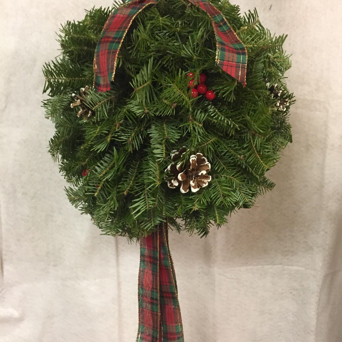 A plaid kissing ball